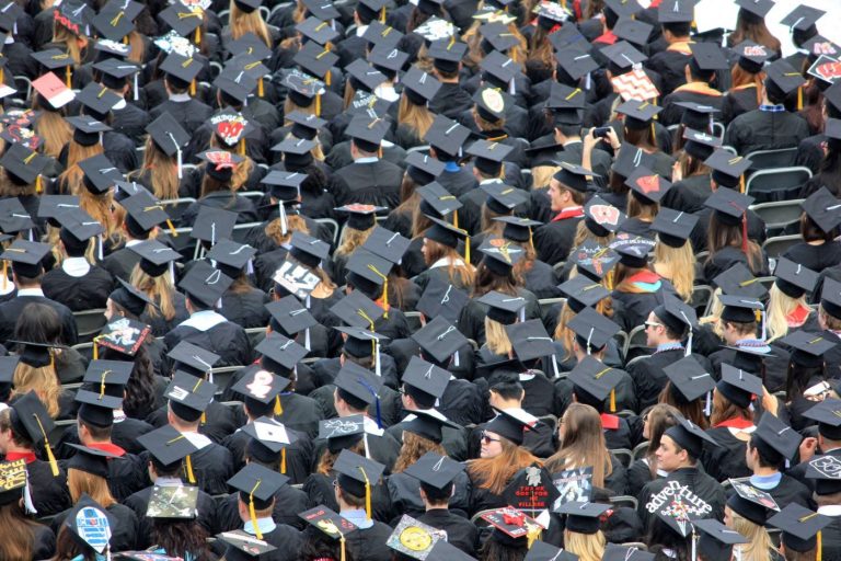 Graduates gather during their graduation.