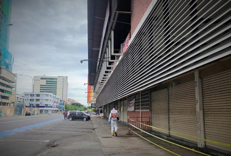 Worker santising street in Kota Kinabalu