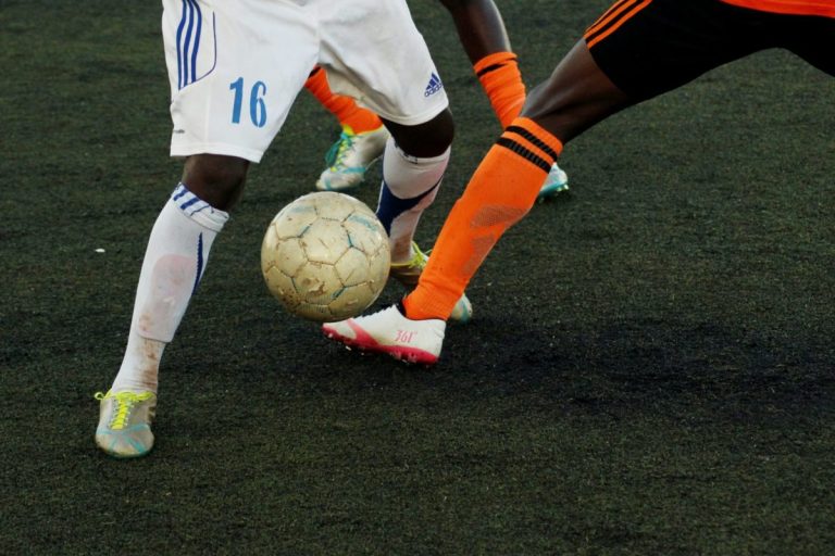 Threatening media, racism in football should be given the boot