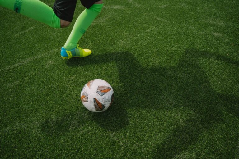 Man about to kick a ball.