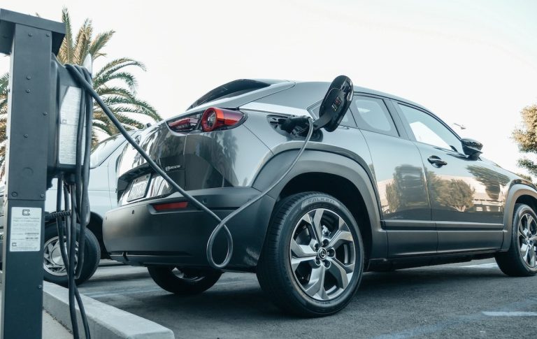 An electric vehicle getting charged.