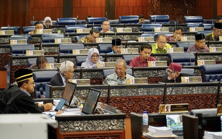 Hamzah Zainudin next to Muhyiddin Yassin in Parliament