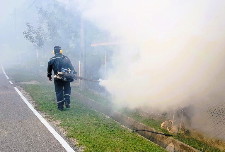 A man fogging a neighbourhood in Malaysia in 2024.