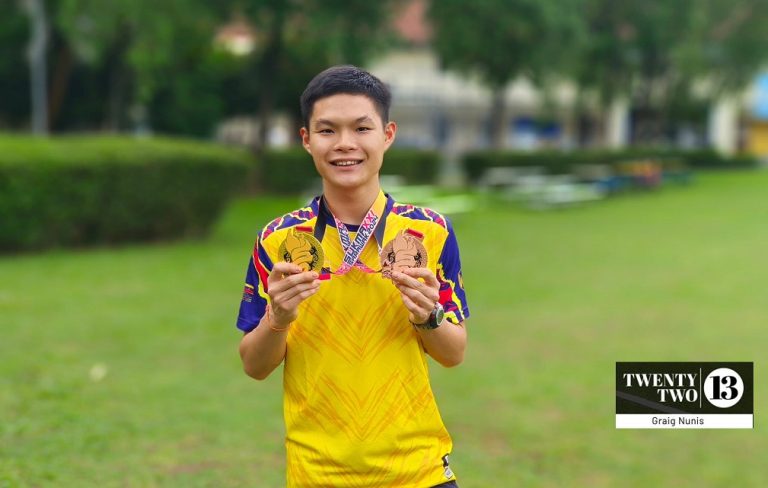 Malaysia Games race walking champion Shannon Khor Jing Hong with his medals. Image: Graig Nunis / Twentytwo13