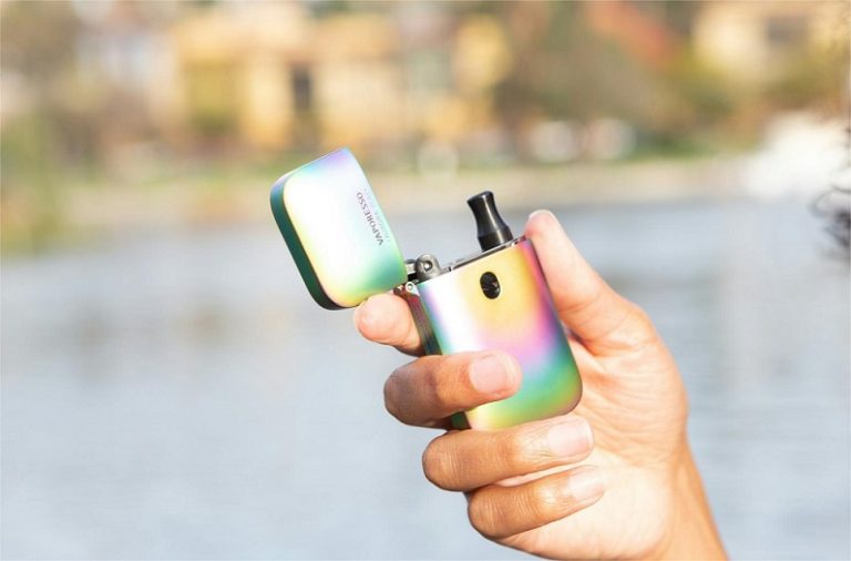 A woman holding a vape.