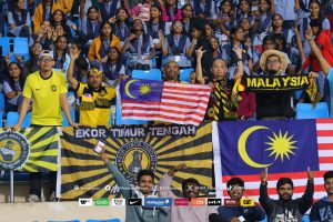 A group of Malaysian fans cheering on Harimau Malaya in a friendly against India. Southeast Asian fans are passionate about the Asean Championship Cup, which kicks off on Dec 8.
