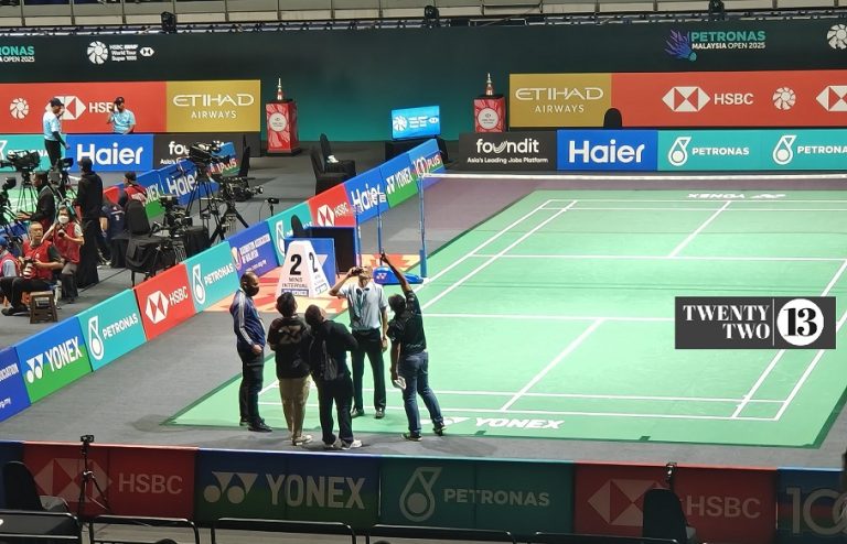 Officials looking up at the leaking roof at the Axiata Arena in Bukit Jalil, Kuala Lumpur during the Malaysia Open 2025.