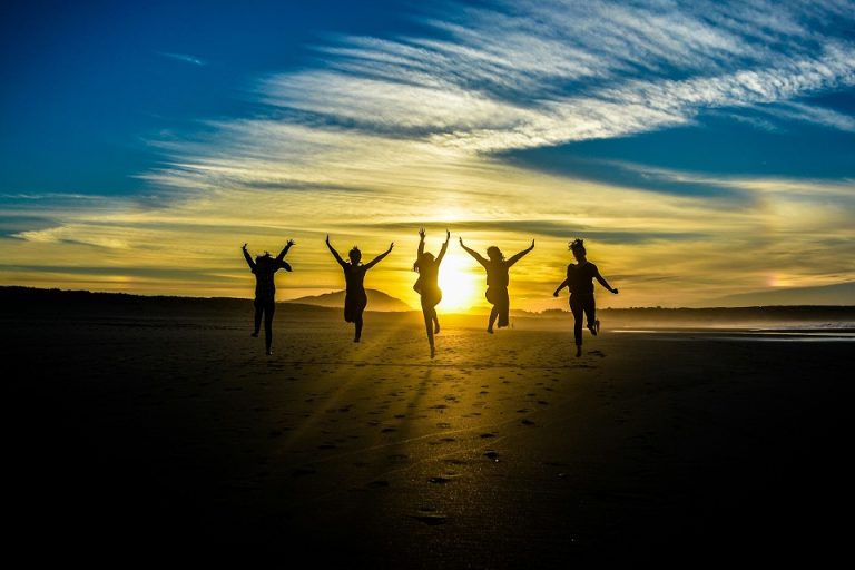 Several individuals jumping for joy.