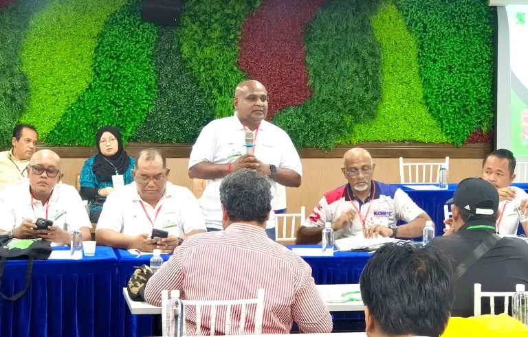 Kuala Lumpur Hockey Association president I. Vickneswaran (standind), says he will work closely with Kuala Lumpur City Hall to get a new pitch for the Pantai Hockey Stadium.
