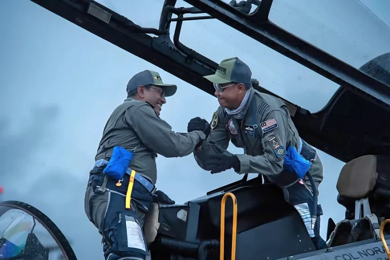 General Tan Sri Asghar Khan Goriman Khan and Colonel Mohd Norazan Othman exchange handshakes after a phenomenal display at LIMA '25 in May 2025.