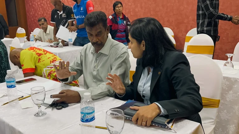 Selangor Athletics Association president Nurhayati Karim (right) having a chat with Petaling Athletics Association president Datuk SM Muthu.