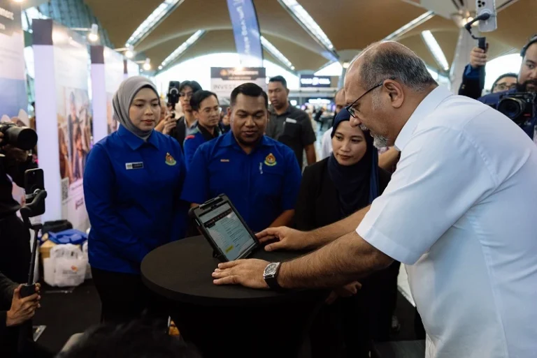Digital Minister Gobind Singh Deo takes a closer look at the RAI Portal after launching it at the Kuala Lumpur International Airport in Sepang on June 17, 2025.