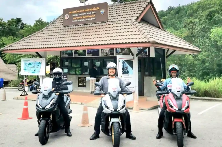 The writer and the two other riders on their motorcycles in Thailand.