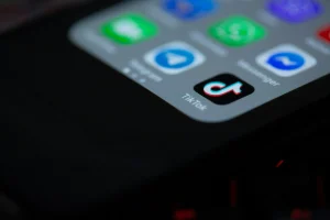 A TikTok icon on a phone.