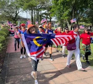 SeniorsAloud members walking with the Jalur Gemilang at Taman Jaya, Petaling Jaya on Aug 29, 2025.