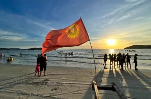 A scene at a beach in Langkawi with the Kedah flag flying.