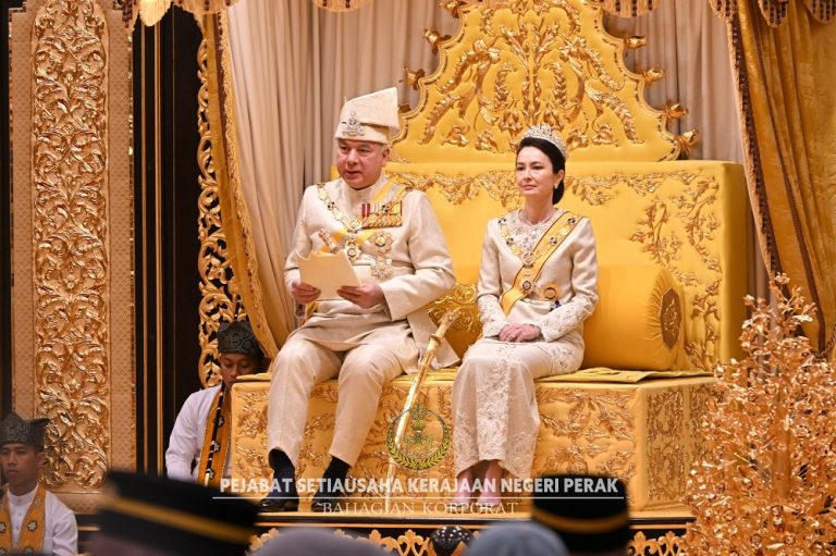 Sultan Nazrin Muizzuddin Shah reading his speech while he is accompanied by his consort Tuanku Zara Salim at Istana Iskandariah in Kuala Kangsar, Perak