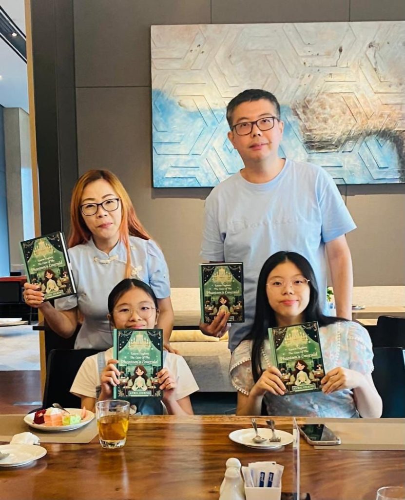 Avril (seated left) says that her family, Vanessa, Tan, and Ng, have been supportive of her writing journey.