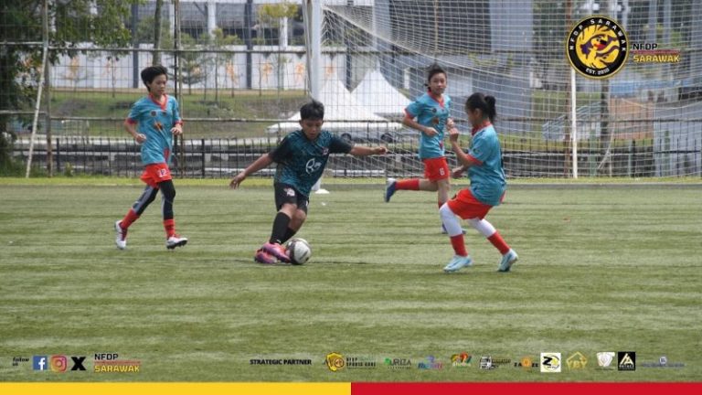 Girls and boys playing football in an NFDP Sarawak event in 2024.