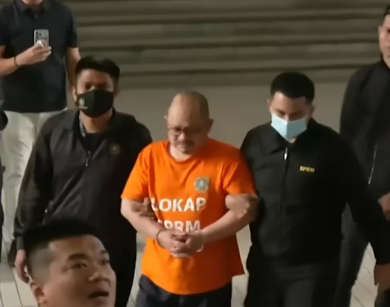 Datuk Seri Shamsul Iskandar Mohd Akin, in handcuffs, being taken to the Putrajaya Court Complex on Nov 28, 2025.