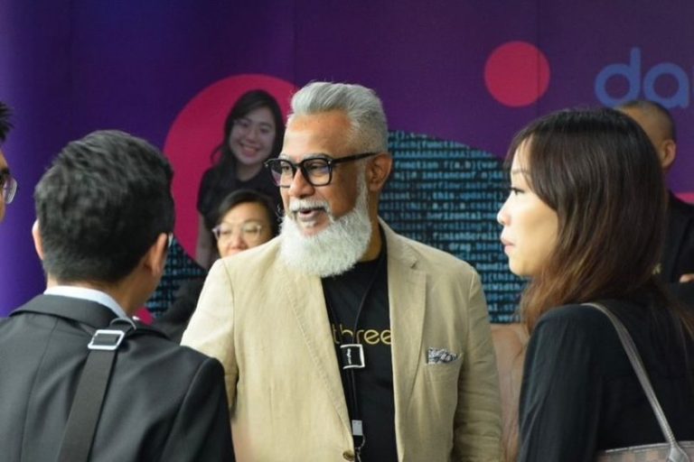 Raymond Davadass speaking to officials from other businesses during an event during an event in June 2025. Image: Daythree