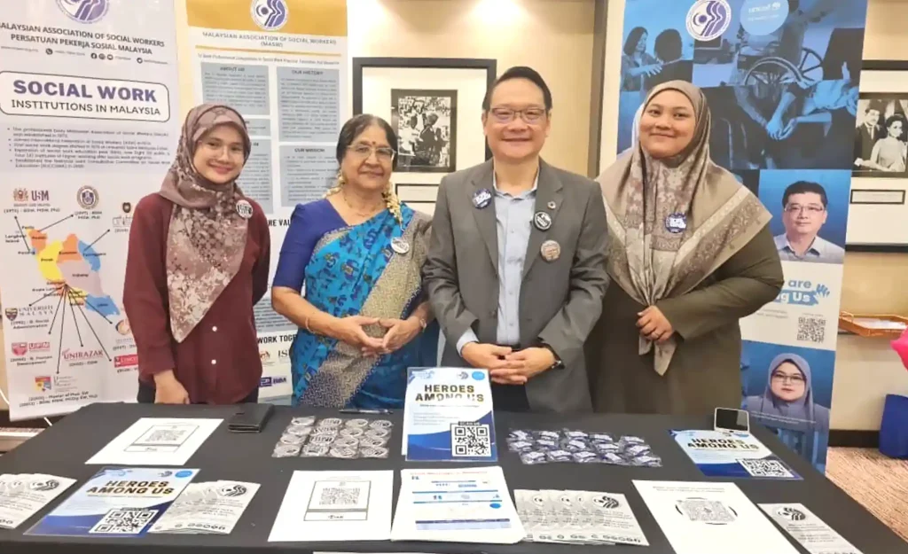 Malaysian Association of Social Workers president Dr Teoh Ai Hua (second from right) and the association's honorary secretary Amy Bala (second from left).