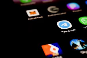 Telegram icon on a mobile phone.