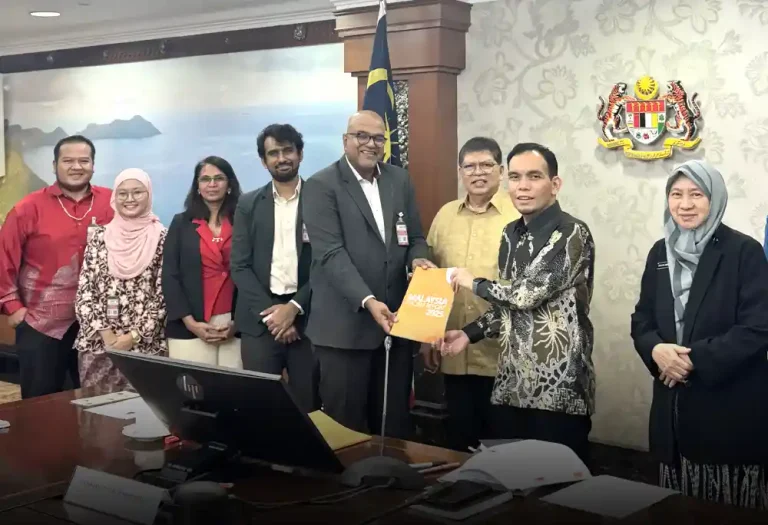 Pusat Komas director Jerald Joseph presenting the Malaysia Racism Report to the chairperson of APPGM-RRH Syahredzan Johan on April 13, 2026. Looking on is Dewan Rakyat Speaker Tan Sri Johari Abdul.