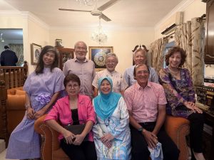 Dr Pola Singh (seated right) with several of his friends during a Hari Raya open house recently.