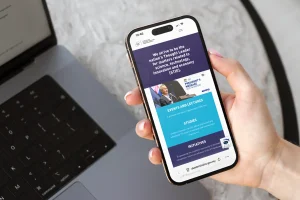 An individual surfing the Academy of Science Malaysia website on his mobile phone.