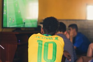 A Brazil fan watching an international match on television.