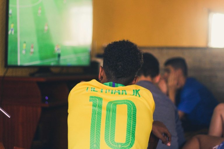 A Brazil fan watching an international match on television.
