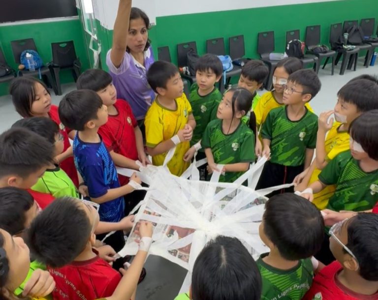 Noraseela Khalid with several pupils during the Inclusive Play session in June 2026.