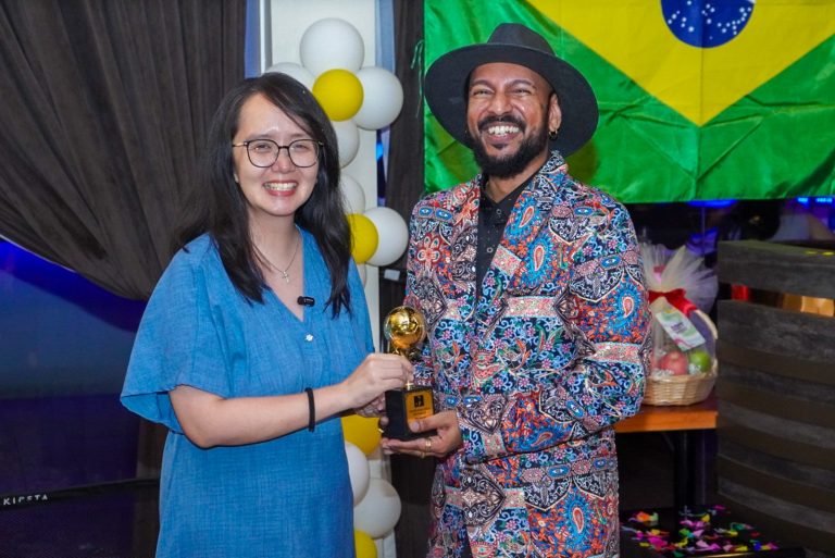 Michelle Ng (left) says the Digital Ministry’s approach to AI and the creative sector recognises the importance of original artistic expression and human creativity. She was the guest of honour at the launch of Justin Lewis’ song, World Fever.