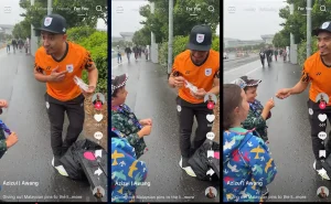 Datuk Azizulhasni Awang giving out lapel pins to two young fans in Glasgow.