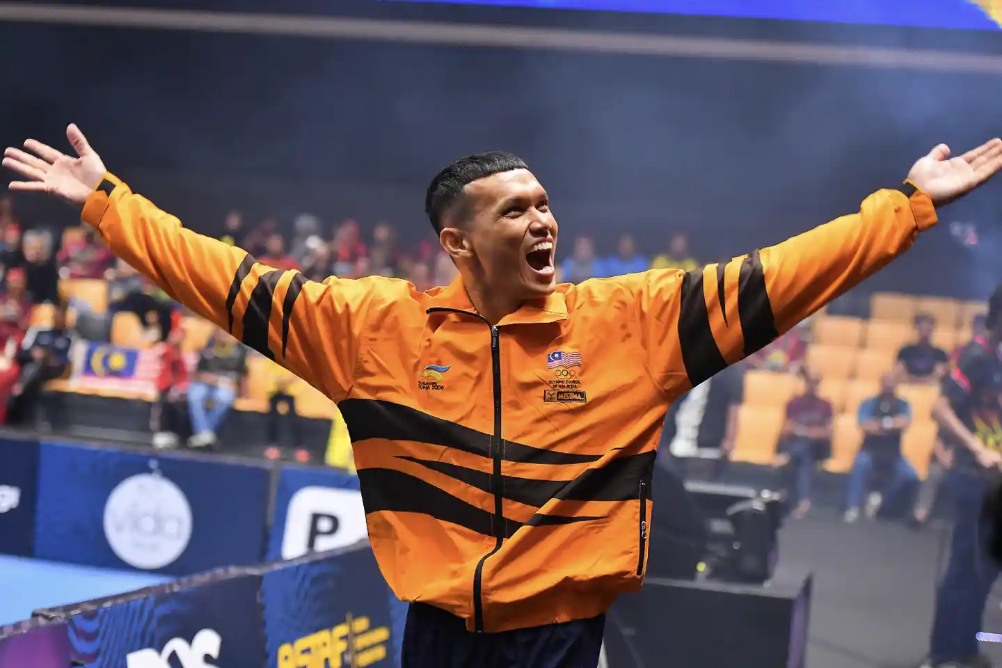 Azlan Mubin cheering on the crowd during a Sepak Takraw League competition in 2025.