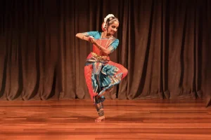 Sheela Rhagavan dancing on stage.