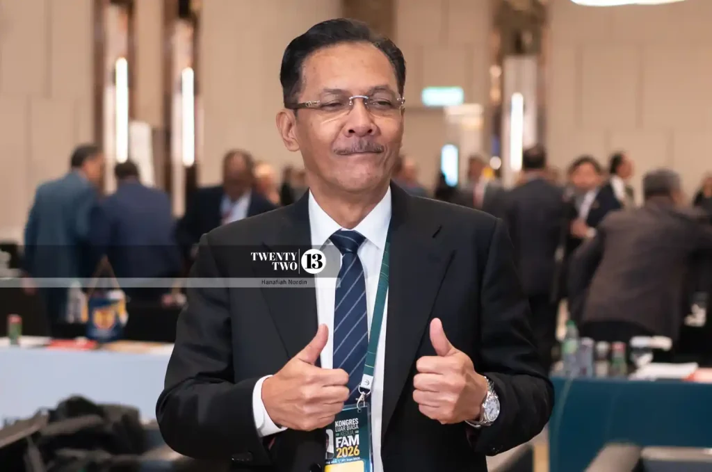 Datuk Ab Ghani Hassan celebrates after being elected as the new FAM president.