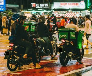 P-hailing riders waiting at a traffic light in Bukit Bintang, Kuala Lumpur.
